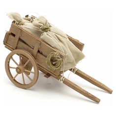 an old fashioned wooden wagon filled with bags