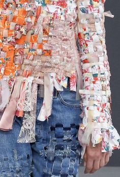 a close up of a woman's shirt and jeans