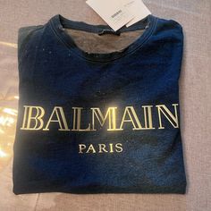 Gorgeous And Stylish Balmain Tee Shirt That Can Be Dressed Up Or Down. Just Purchased In The Mall Of Dubaii. Comes With All Tags And Packaging . Currently Sells For Over $400. Luxury Blue Long Sleeve Tops, Luxury Blue Short Sleeve Top, Luxury Blue Cotton Tops, Designer Blue Cotton T-shirt, Blue Designer Cotton T-shirt, Designer Blue Crew Neck T-shirt, Designer Blue Crew Neck Top, Designer Blue Tops With Logo Print, Luxury Blue Tops For Summer