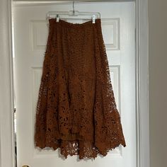 This Skirt Has Never Been Worn. I Purchased It For A Party And Decided To Wear Something Else. It’s A Beautiful Crochet Design With A Midi, Length Tulip Shape Perfect For A Garden Party Or An Evening Out. Asymmetrical Lace Party Skirt, Party Lace Asymmetrical Skirt, Asymmetrical Lace Skirt For Party, Brown Party Bottoms With Flowy Fit, Party Lace Lined Maxi Skirt, Party Lace Maxi Skirt With Lining, Party Brown Lined Maxi Skirt, Party Lace Tiered Maxi Skirt, Party Brown Flared Skirt