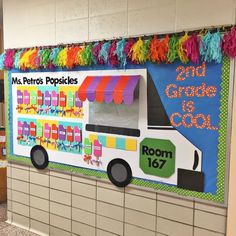 a school bus decorated with colorful streamers and pom - poms on the wall