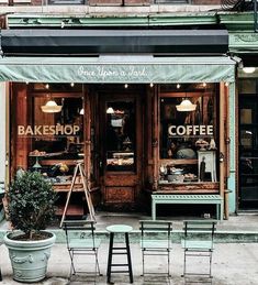 an outdoor cafe with tables and chairs outside