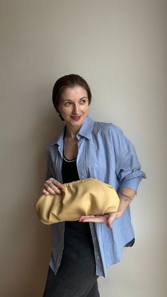 Stylish beige woman clutch. The perfect size for a wedding party, evening walk, going to a party and any other event. Beige women's clutch is always a timeless style. Unique designer women's handbag will fit perfectly into your wardrobe and will be the most favorite handbag for many looks. Size 38*18 cm, perfectly accommodates everything you need: phone, charger, cosmetics, wallet, etc. The set can be a chain in gold or silver color of your choice. I sew individually. If you want this handbag model in another size convenient for you, just note me. I can also offer you a huge selection of inner lining. The handbag will be exclusive. Dumpling clutch keeps its shape without anything inside. Material - ecoleather premium quality. Color from the photo - Beige Bag will come in a nice linen bag. Chic Cream Clutch Pouch, Cream Clutch For Everyday Use, Formal Cream Clutch With Removable Pouch, Modern Beige Clutch For Evening, Modern Beige Pouch Clutch, Chic Pouch Clutch, Chic Clutch Evening Bag, Modern Beige Pouch Evening Bag, Cream Pouch Clutch For Evening