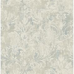 a white and blue wallpaper with an ornate design on it's surface,