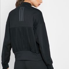 Perfect Lightweight Front Zip Adidas Bomber Jacket. Mesh Paneling In Back And Under Arms. Comfortable Poly-Cotton Blend Fabric. Dual Side Slip-In Pockets. Adidas Black Athleisure Outerwear, Black Track Jacket With Ribbed Cuffs For Work, Adidas Long Sleeve Track Jacket In Athleisure Style, Adidas Long Sleeve Athleisure Track Jacket, Black Stretch Track Jacket For Spring, Black Track Jacket For Fall, Black Track Jacket For Workwear In Fall, Black Track Jacket For Work In Fall, Black Track Jacket For Fall Workwear