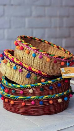 several woven baskets stacked on top of each other