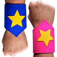 two wristbands with yellow and blue stars on each one, both made out of felt