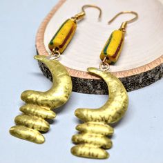 Akoben Brass Earrings Adinkra , Dangeling Earrings With Krobo Beads I Made This From My Own Studio In Los Angeles. Earring Size: 10cm X 2cm Metal Type: Brass Bead Type: Krobo Beads It Comes In A Gift Bag Yellow Dangle Earrings For Jewelry Making, Artsy Gold Dangle Earrings, Artsy Yellow Jewelry With Ear Wire, Artsy Gold Metal Earrings, Unique Yellow Jewelry With Matching Earrings, Nickel Free Yellow Dangle Beaded Earrings, Artsy Gold Earrings With Ear Wire, Artsy Yellow Earrings For Pierced Ears, Yellow Brass Earrings As A Gift