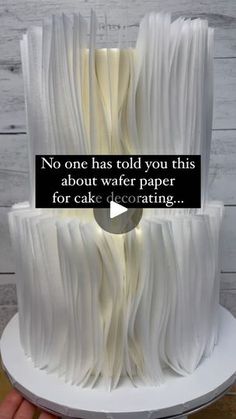 there is a cake that has been made to look like an open book with the words, no one has told you this about water paper for cake decorating