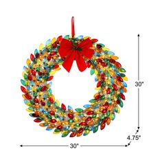 a christmas wreath ornament with lights and a bow hanging from the front, on a white background