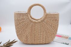 The handicraft this high quality and beautiful bag Perfect to be used for: Beach Shopping Normal daily use Shop the latest styles of popular handbags & best handbags for women Straw Weave Handbag with Detachable Strap bag is 100% handcrafted by local Thailand artists, from a waterhyacinth. The work is exquisite and of a very high quality. the bags is created with love and hand worked, that makes it unique and one of a kind also a perfect bag or gift for a girl Material: water hyacinth Lining : c Straw Bag With Round Handle For Vacation, Straw Bags With Round Handle For Vacation, Vacation Straw Bags With Round Handle, Summer Vacation Bag With Round Handle, Eco-friendly Shoulder Bag With Round Handle For Vacation, Beach Season Bag With Braided Round Handles, Bohemian Bags With Round Handle For Vacation, Natural Color Bags With Round Handle For Beach Season, Casual Bags For Beach Season With Round Handle