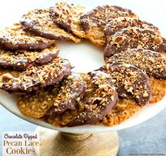 chocolate dipped pecan lake cookies on a white plate