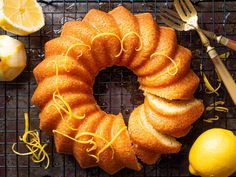 a bundt cake with lemons on a cooling rack