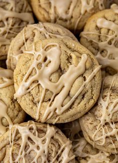 chocolate chip cookies with white icing and drizzled on top in a pile