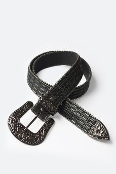 The Mirrored Studded Belt is made from black leather and features intricate Western design motifs on the metal buckle, end tip and loop, with black mirrored embellishment and studs throughout. Design Details 100% leather metal buckle and trims S/M fits waists 32" - 36" M/L fits waists 36" - 40" Studded Belt Overlap Scene, Gold Studded Belt, Studded Belt Overlap, Adjustable Black Belts With Studs, Layered Hoodie, Studded Belt, Western Design, Denim Patchwork, Black Mirror