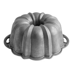 a metal bundt cake pan on a white background