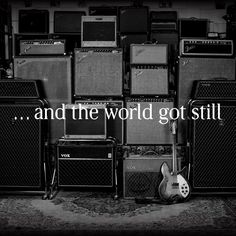 an image of guitars and amps in black and white with the caption'and the world got still '