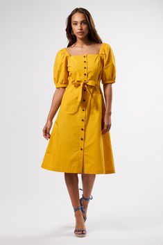 In crisp organic cotton poplin with a hint of Parisian charm, this effortless silhouette will have you perfectly dress(ed) for any occasion.Square neck, button-front dress with elastic at shoulders, puff sleeves, and front patch pocketsPrincess seams at front and mocked panel at back for fit Self-belt loops and detachable self-beltStyle has a slim fit, and can size up if desired100% Organic Cotton43" in LengthEthically Made in India Cotton A-line Midi Dress With Button Closure, Cotton Midi Dress With Buttons For Daywear, Cotton Midi Dress With Button Closure, Cotton Midi Dress With Button Closure For Daywear, Chic Cotton Midi Dress With Button Closure, Cotton Midi Dress With Button Closure For Day Out, Knee-length Cotton Midi Dress With Buttons, Cotton Midi Dress With Buttons For Day Out, Cotton Button-up Midi Dress With Button Cuffs