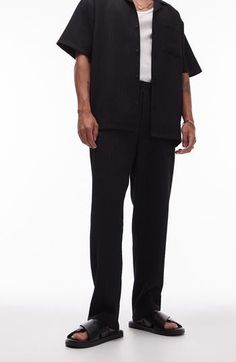 Textural rib lends depth to these edgy wide-leg trousers topped by a comfy elastic waist. 26 1/2" inseam; 14" leg opening; 13" front rise; 17 1/2" back rise (size Medium) Elastic waist Front slant pockets; back welt pockets 94% polyester, 6% elastane Machine wash, line dry Made in Turkey Oversized Straight Leg Bottoms For Workwear, Casual Wide Leg Pants With Ribbed Waistband For Work, Casual Dress Pants With Relaxed Fit And Straight Hem, Black Wide Leg Pants With Pockets And Straight Hem, Black Relaxed Fit Dress Pants For Fall, Black Pants With Straight Hem For Spring, Black Wide-leg Pants With Ribbed Waistband, Black Straight Hem Pants For Spring, Ribbed Workwear Pants