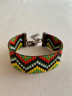 Bohemian Woven Braided Bracelets, Traditional Multicolor Woven Beaded Bracelets, Handmade Braided Bracelets With Round Beads For Festivals, Traditional Beaded Bracelet As Gift, Traditional Beaded Bracelets As Gift, Unique Multicolor Woven Beaded Bracelets, Bohemian Woven Bracelets With Round Beads, Bohemian Woven Beads For Festivals, Multicolor Woven Braided Bracelets