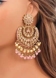 These Polki earrings are a classic addition to any traditional outfit with their stunning stones, crystals, and pearls. They add an exquisite charm and make for the perfect accessory to complete your look. Earrings length: Approx. 3.5" Weight of each earring: 31 gms Push-Back Closure. Antique Gold Plated on high-quality brass as the base metal In-stock & ready-to-ship Color may vary slightly due to light condition & photography. Jewelry Care: Keep away from moisture. Allow perfumes and lotion to Luxury Bridal Earrings With Latkans For Parties, Luxury Diamond Earrings With Latkans, Luxury Kundan Jhumkas With Tilla, Luxury Heavy Kundan Bridal Earrings, Luxury Heavy Bollywood Earrings, Luxury Chandbali Jewelry Sets With Latkans, Luxury Round Meenakari Bridal Earrings, Luxury Diamond Latkans Earrings, Luxury Festive Pearl Earrings With Latkans