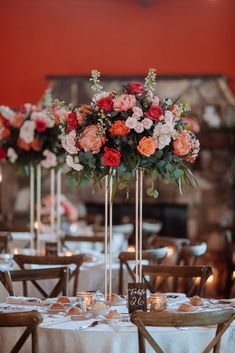 the centerpieces are decorated with flowers and candles