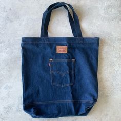 - Levi’s - Tote Bag - Jeans - New With Tags - Internal Pocket - See Pictures For Detailed Measurements Large Bags With Pockets, Large Everyday Bags With Pockets, Everyday Denim Shoulder Bag With Handles, Everyday Denim Tote Bag, Blue Shoulder Bag With Flat Pocket For Daily Use, Shopping Bag With Removable Pouch In Denim, Blue Travel Bags With Flat Pocket, Levi's Casual Bags For Everyday Use, Casual Levi's Bags For Everyday Use