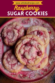 raspberry sugar cookies on a red plate with the words, strawberry sugar cookies