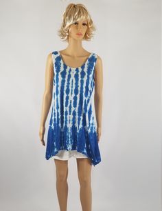 NEW size 3XL now available! Ladies Tie Dyed blue and white striped Shibori dyed tunic top. Remember that all computer monitors vary and the colors of this top have not been edited for color. I hand dye all of my items myself and as such slight variances may occur in the dyeing process, as such please remember to enjoy an artists hand. I will try to get this as close to the photograph as possible. Made of 100% Cotton. The tank tunic has a turned and & stitched down V-neckline, armholes & Blue Casual Tunic With Relaxed Fit, Indigo Sleeveless Top For Spring, Sleeveless Indigo Tops For Spring, Hand-dyed Blue Tops For Spring, Blue Casual Summer Tunic, Casual Blue Summer Tunic, Casual Hand Dyed Tank Top For Summer, Hand Dyed Sleeveless Top For Spring, Casual Hand-dyed Tank Top For Summer