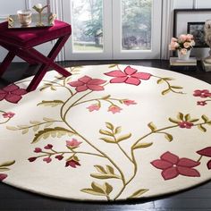 a white rug with pink flowers on it