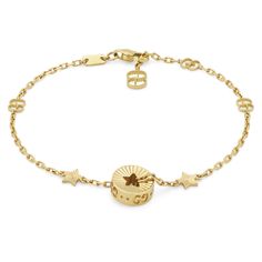 From Gucci, this precious bracelet is presented in 18k yellow gold with a delicate chain featuring the GG motif. The piece's focal point is a circular charm featuring a cut-out star, that recalls the Cruise 2023 Gucci Cosmogonie fashion show. Taking place beneath the night sky at the Italian Castel del Monte, the collection draws inspiration from star constellations. 18k yellow gold Charm with cut-out star GG motif Clasp closure Adjustable length: 6.3" or 7" Made in Italy Gucci guarant Gucci Gold Jewelry, Designer Gold Gucci Jewelry, Elegant Gucci Yellow Gold Jewelry, Gucci Gold Jubilee Bracelet, Luxury Gucci Yellow Gold Bracelet, Gucci Gold Metal Jewelry, Engagement Ring Guide, Wedding Day Jewelry, Diamond Supply