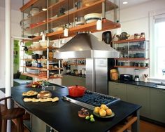 a kitchen with lots of shelves filled with food