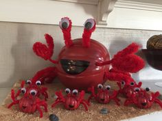 a group of red crabs sitting on top of a counter