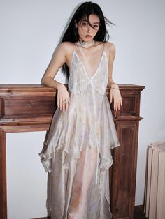 The JNYLON STUDIO Ethereal Fairy Slip Dress is a women's ivory maxi dress made from layered chiffon, featuring a whimsical handkerchief hem. This dress offers an elegant and floaty silhouette, perfect for special occasions or a dreamy summer look. Crafted from high-quality, breathable fabric, it ensures comfort and sop Floaty Fairy Dress, Sheer Layered Dress, Layered Sheer Dress, Sheer Chiffon Dress, Sheer Overlay Dress, Ethereal Fairy, Ivory Maxi Dress, Lace Ruffle Dress, Casual Date Night