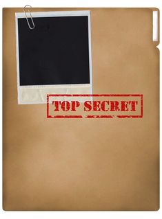 the top secret stamp is placed on a piece of brown paper