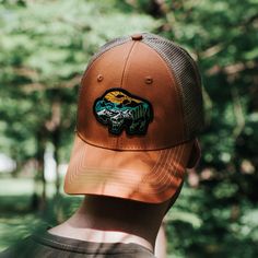 Our custom 6 panel classic trucker hat is great for any occasion. Woven Bison patch. Snapback One size fits most. Trucker Hats, Burnt Orange, Riding Helmets, Trucker Hat, Baseball Hats, Running, Orange, Hats