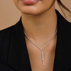 The Lily Necklace is all about effortless elegance. Encircling the neck in 3.38 carats of glittering diamonds, this style doubles up on sparkle with two asymmetrical drops featuring bezel-set pear diamonds resting on each end. Y Necklace Diamond, Timeless Diamond Jewelry, Modern Diamond Necklace, Elegant Diamond Necklace, Modern Necklace Design, Lily Necklace, Diamond Drop Necklace, Double Necklace, Modern Necklace