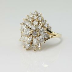 14K Yellow Gold 3ct Diamond Domed Cocktail Ring, H color - VS/SI clarity, 4.25mm center rounds to one side, marquise to other half almost pear shaped top, on bypass band split shank open wire work support, 7/8 inch across, 1/2 inch above finger, 5 tiers, 31 round diamonds, 11 marquise diamonds, Ring size 7.25, Circa 1960, 6.9 grams SKU# BB286R25 This listing contains photographs of the actual item you will receive. Our items are in excellent condition with little or no signs of wear and many are Gold Coin Ring, Coin Ring, Marquise Diamond, Fine Jewelry Designers, Gold Coins, Blue Topaz Ring, Multi Stone, Multi Stone Ring, Topaz Ring