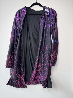 Seller Notes: Double Lined Robe For Extra Warmth!
Pilling on Bottom Of Robe
Trippy Design
Pockets 
Hood Attached
FRW Exclusive Item; Condition: New With Tags; This item is sold directly from Freedom Rave Wear, and might be samples, production units, returned items, or more; Freedom Rave Wear Couture Skirts, Trippy Designs, J Valentine, Rave Fashion, Fringed Belt, Cutout Bodysuit, Black Sparkle, Rave Wear, High Waist Bottoms