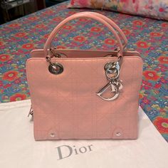 This Is A 100% Authentic Lady Dior Cannage Bag In Calfskin Leather In A Gorgeous Pale Pink Color Silver Hardware Including Dior Lock And Keyall Hardware Is Shiny W/No Tarnishingcorners Are Clean, No Odors Whatsoever, Smoke Free Homeinside Lining Is In The Classic Dior Trotter Printthe Only Callout Is A Small Makeup Stain(See Next To Last Pic) It’s Very Small & It Probably Would Come Out W/A Cleaningcomes W/Dior Dust Bagnot Bundle Eligible Buy W/Extreme Confidenceseller(Read All My Amazing Review Classic Dior, Pale Pink Color, Small Makeup, Makeup Stain, Dior Handbags, Beautiful Lady, Trotter, Lock And Key, Lady Dior