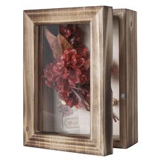 a wooden frame with flowers in it