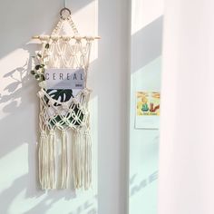 a macrame hanging on the wall next to a door