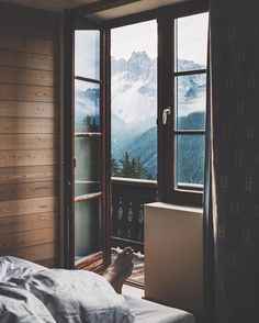 the instagram page on instagram com shows an image of a bedroom with mountains in the background