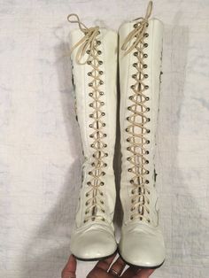 "1960s / early 70s GoGo boots white leather lace up embroidered floral detail w/tiny metal studs around the embroidery the flowers are embroidered patches and edges curl up a bit rubber heel and sole caps good vintage condition, light wear light scuffs, stains, age wear instep of right boot has a slight gap between sole and leather when worn the foot should secure this area w/it's weight could be taken to shop to secure *priced w/the possibility of that cost in mind label size 9 M, fit me true t Vintage White Boots, Vintage Wedding Boots, 70s Gogo Boots, 60s Gogo Boots, Vintage Lace Up Boots, 60s Boots, White Lace Up Boots, 60s Shoes, 70s Boots