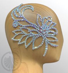 a headpiece made out of crystal stones on a mannequin's head