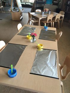 the table is covered with plastic and flowers