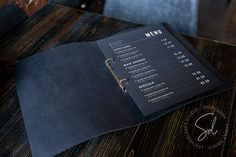 a menu sitting on top of a wooden table