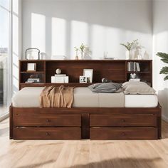 a bed with two storage drawers underneath it