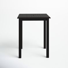 a small black table sitting on top of a white floor