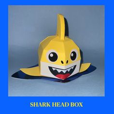 an origami shark head box is shown with the words shark head box below it